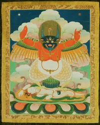 Thangka painting of Garuda trampling a dying naga